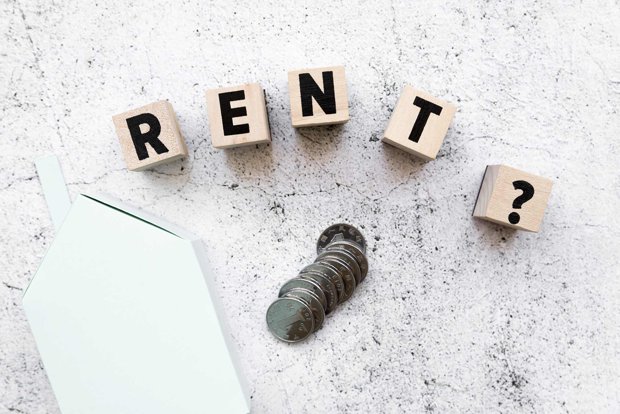 Blocks spelling the word "RENT?"